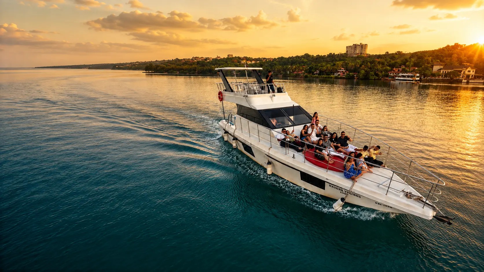 Luxury yacht cruising Karnataka's coastline at sunset